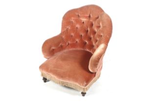 A Victorian pink velvet button back nursing chair.