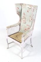 An Art Nouveau wing back armchair.