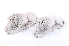 A pair of contemporary 'Canova' lions. Depicted reclining on a plinth, heads resting on their paws.