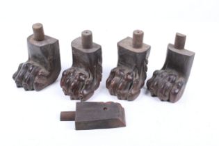 A set of four carved walnut lion's paw feet.