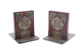 A pair of Chinese hardwood and brass bookends.