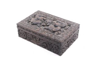 A 20th century Chinese carved hardwood box full of buttons.