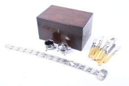 A Victorian mahogany box containing a selection of silver plate.