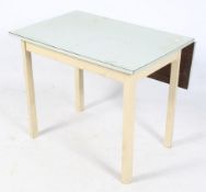 A mid-century retro drop leaf table. The blue top mounted on cream wooden supports, H73.5cm x W90.