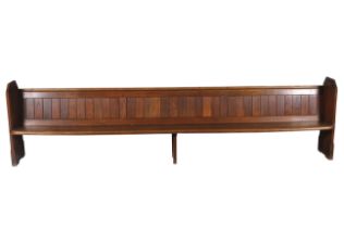 An early 20th century oak church pew.