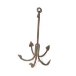 A vintage cast metal ships anchor.