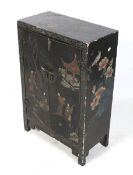 A 20th century Chinese black lacquer cabinet.