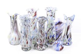 Seven Murano multi-coloured glass vases.