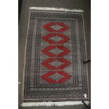 A 20th century wool rug.