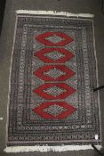 A 20th century wool rug.