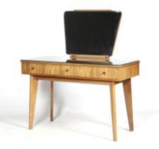 A Cumbrae Furniture by Morris of Glasgow dressing table and a stool.