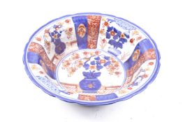 A 20th century Chinese ceramic basin. With blue and red painted floral decoration, unmarked.