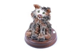 A Patricia M Telford studio pottery sculpture of a cat.