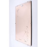 A mid-century bevelled edge frameless wall mirror. Rectangular and tinted. 39.