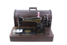 An antique hand crank Singer sewing machine. S/N F8235297.