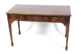 A early 20th century mahogany library/writing table desk.