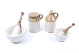 Two vintage pestle and mortars with two stoneware items. Including pestle stamped 'No.