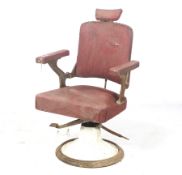 A vintage French Cre-Rossi Lyon barber's chair.