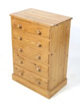 A contemporary pine chest of drawers.