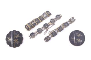 Three Japanese mixed metal inlaid komai technique damascene bracelets and two brooches.