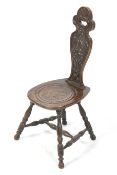 A vintage carved oak spinning chair.