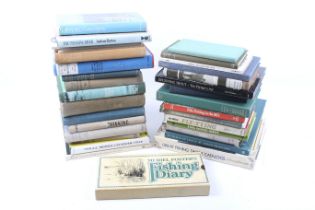 A collection of assorted fishing books and catalogues.
