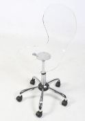A contemporary clear perspex 'egg' style typist chair. On a chrome base with casters.