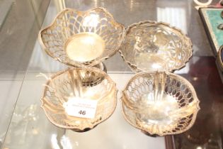 A pair of silver shaped-oblong pedestal sweet dishes and two others.