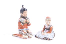 Two Royal Copenhagen porcelain figures of girls with flowers.