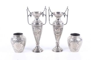 Two pairs of middle eastern, probably Persian white metal vases.