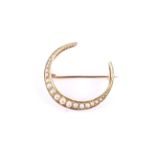 An Edwardian 15ct gold and half-pearl closed-crescent brooch. Hallmarks for Chester 1903, approx.