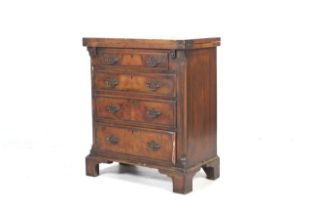 A Georgian walnut veneer chest of drawers card table.