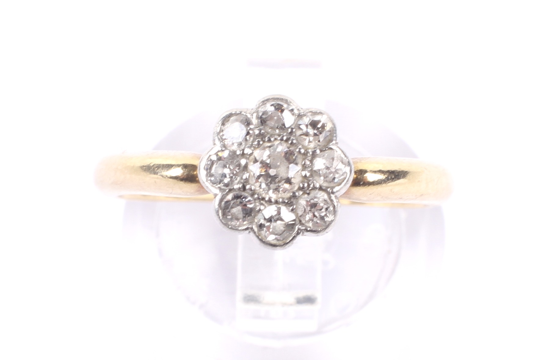 An early 20th century gold and diamond 'daisy' cluster ring, circa 1925. - Image 2 of 4