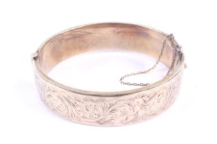 A vintage 9ct gold hollow hinged bangle.