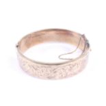 A vintage 9ct gold hollow hinged bangle.