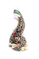 A vintage garnet and enamel brooch in the form of a stylised dolphin or fish after the Holbeinesque