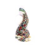 A vintage garnet and enamel brooch in the form of a stylised dolphin or fish after the Holbeinesque