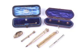 A small collection of gold and other items including an engine-turned pencil barrel.