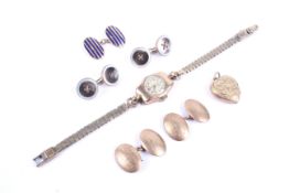 A small collection of jewellery including a pair of 9ct gold domed-oval twin-panel cufflinks.