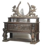 An oak heavily carved sideboard.