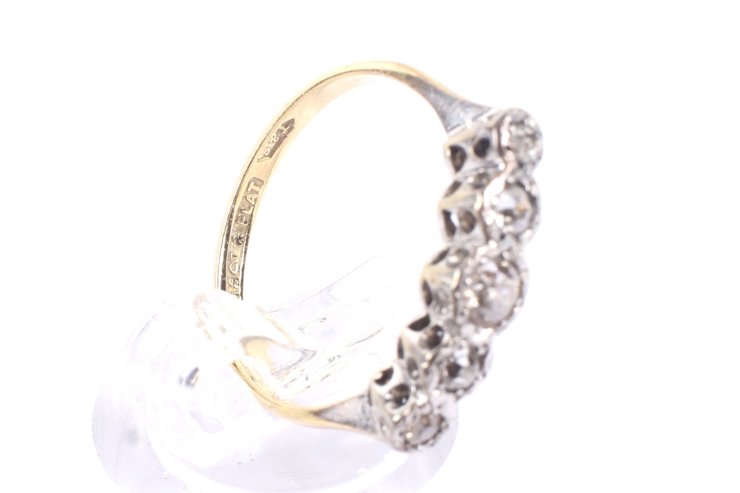 A mid 20th century gold and diamond five stone illusion ring. - Image 4 of 4