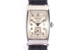 Longines, a vintage stainless steel tonneau shaped wrist watch, circa 1938.