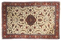 A cream ground rug with blue and red decoration.