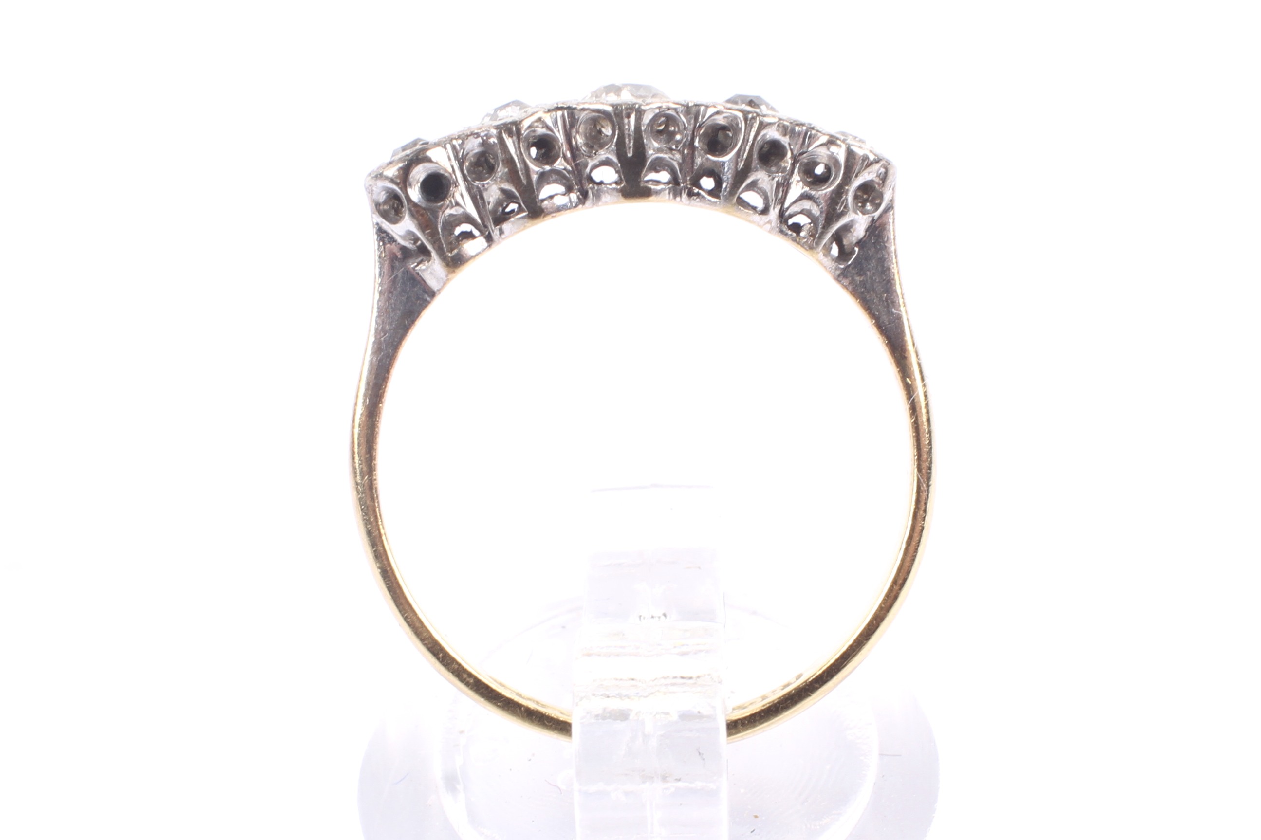 A mid 20th century gold and diamond five stone illusion ring. - Image 3 of 4
