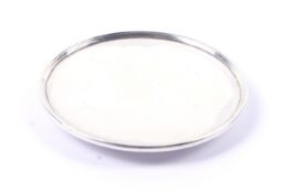 A Guild of Handicrafts silver small round dish or paten.