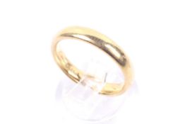 A vintage 22ct gold court-section wedding band. Hallmarks for Birmingham 1926, 3.
