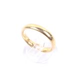 A vintage 22ct gold court-section wedding band. Hallmarks for Birmingham 1926, 3.