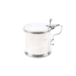 A George III silver drum shaped mustard pot.