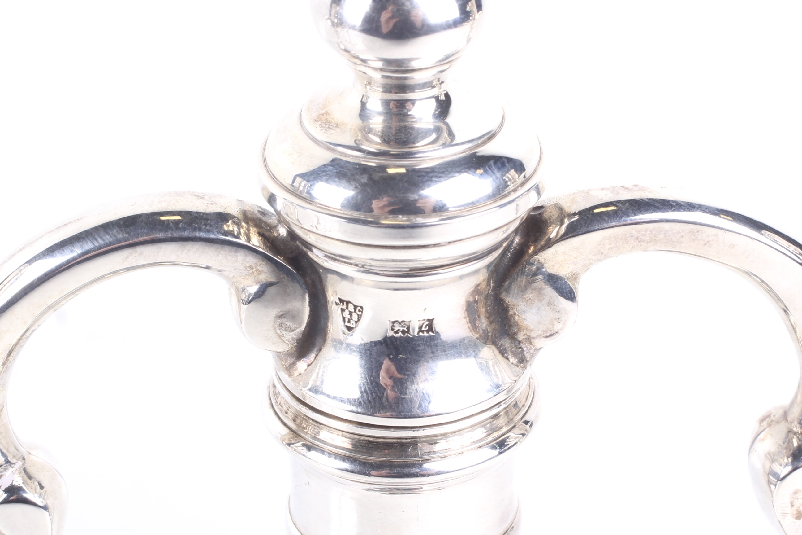 A pair of cast silver two-branch two-light candelabra in George I style. - Image 2 of 2