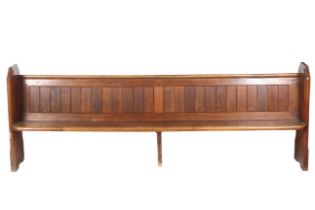 An early 20th century oak church pew.